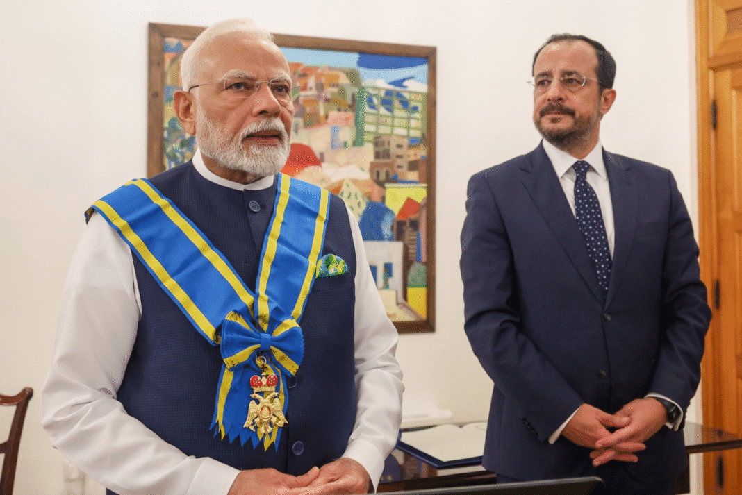 Prime Minister Narendra Modi receiving the Grand Cross of the Order of Makarios III from Cyprus President Nikos Christodoulides.